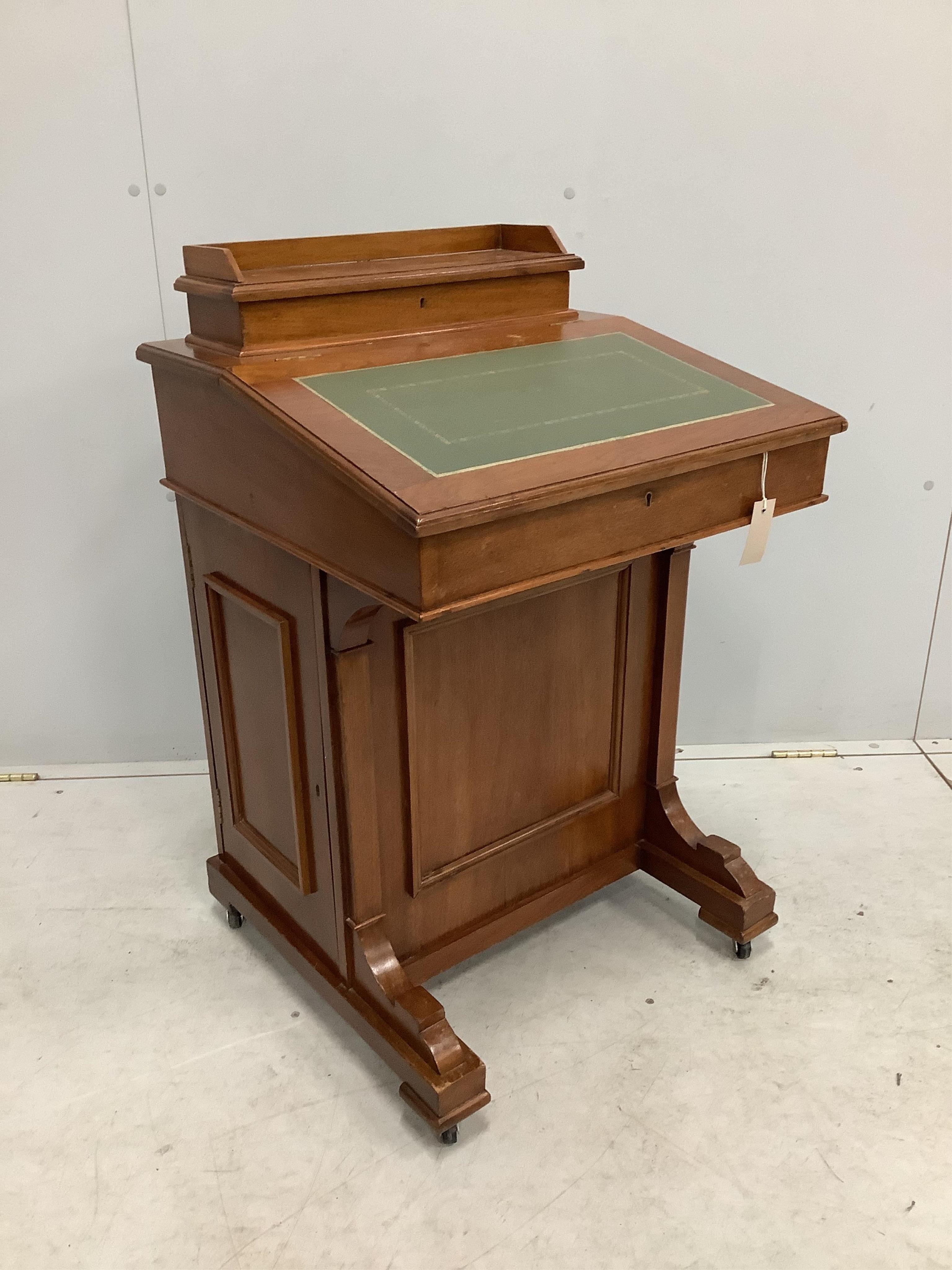 A late Victorian walnut Davenport, width 55cm, depth 53cm, height 87cm. Condition - fair